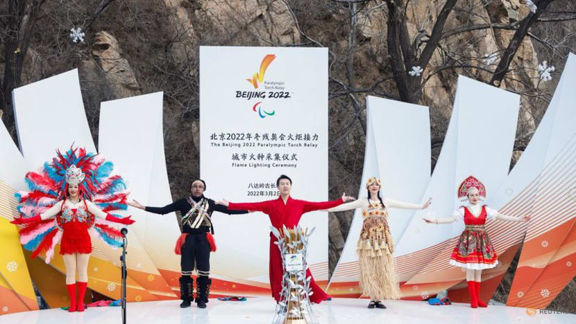 Performers take part in the flame lighting ceremony of the Paralympic torch relay at the Badaling section of the Great Wall in Yanqing district on Mar 2, 2022.