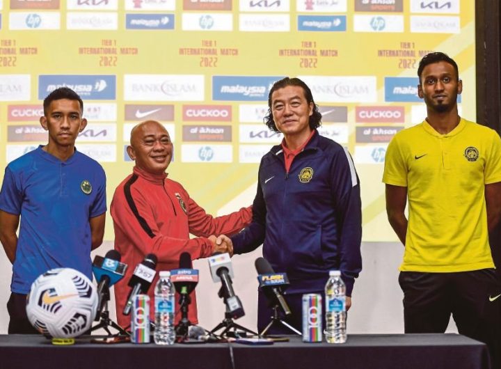 National coach Kim Pan Gon (right) and his Brunei counterpart, Rosanan Samak at a press conference at Wisma FAM in Kelana Jaya yesterday.