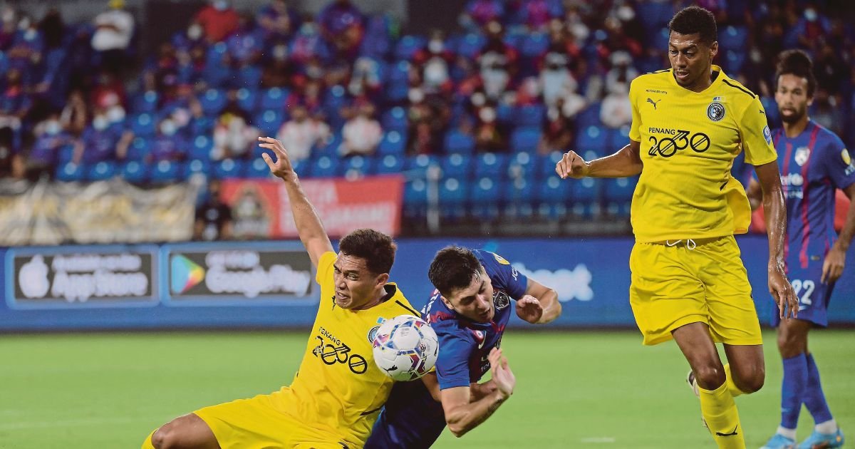 Terengganu’s Tchetche Kipre (right) in action against Penang’s Rafael Vitor during the Super League match at the City Stadium in Georgetown.